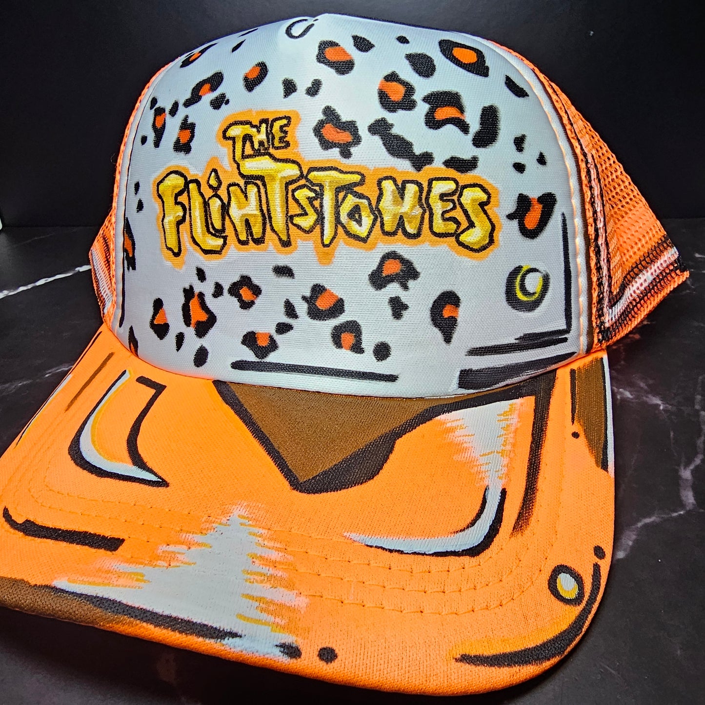 Cartoonized "Flintstones- 🐆 print" trucker hat.